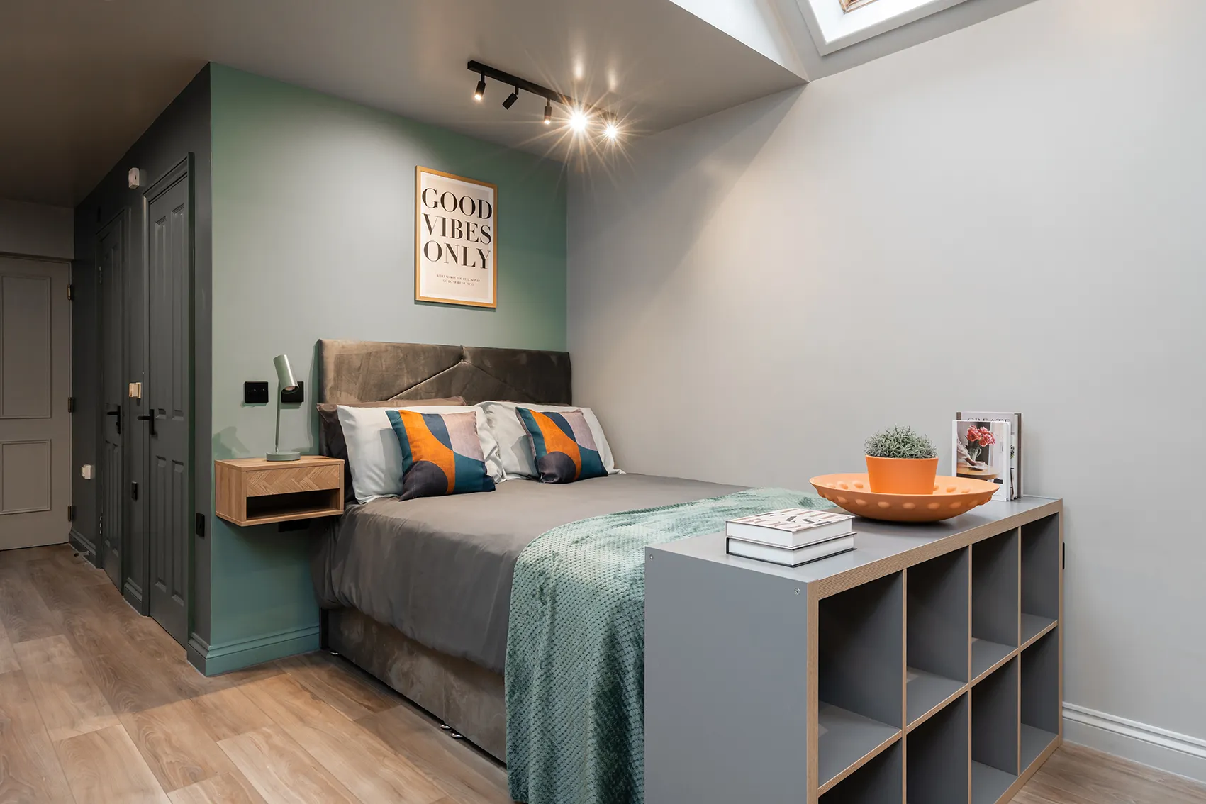 Furnished en-suite bedroom with a double bed and storage